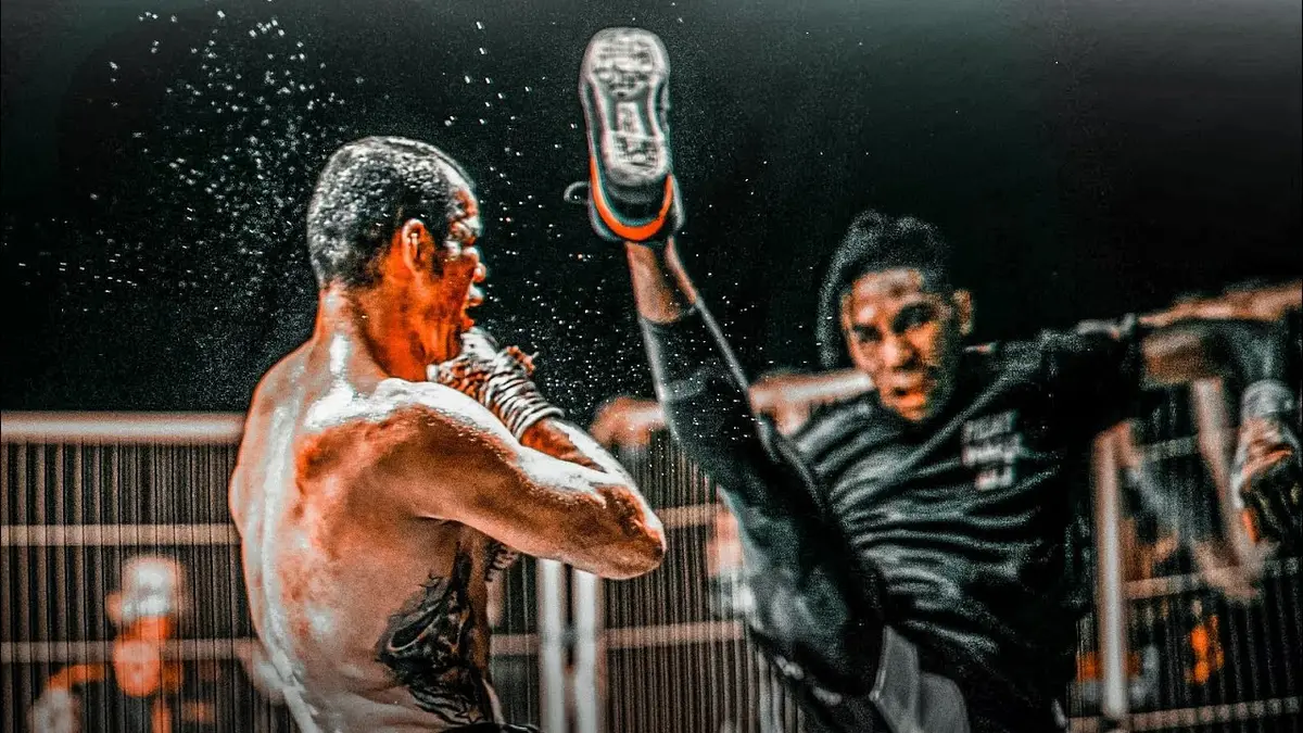 A fighter landing a high kick on an opponent inside a cage
